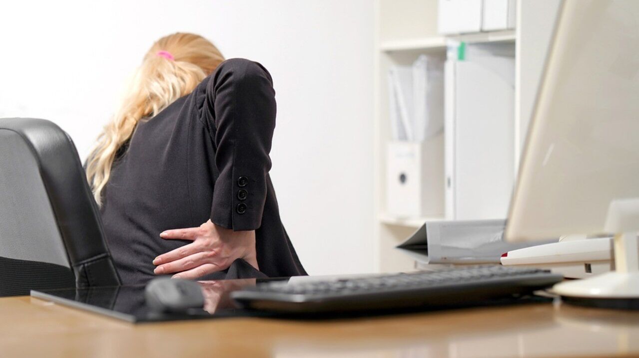 A woman is worried about pain in the lower back. 