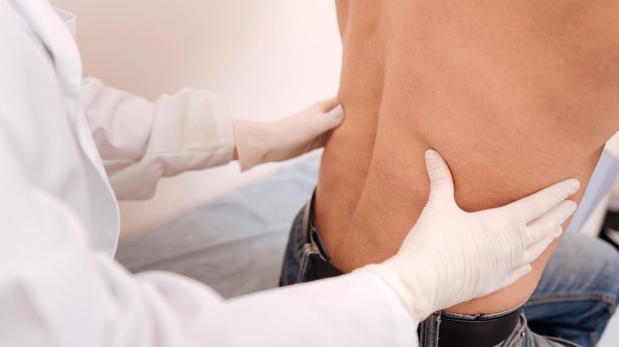 Initial examination of a patient with low back pain.